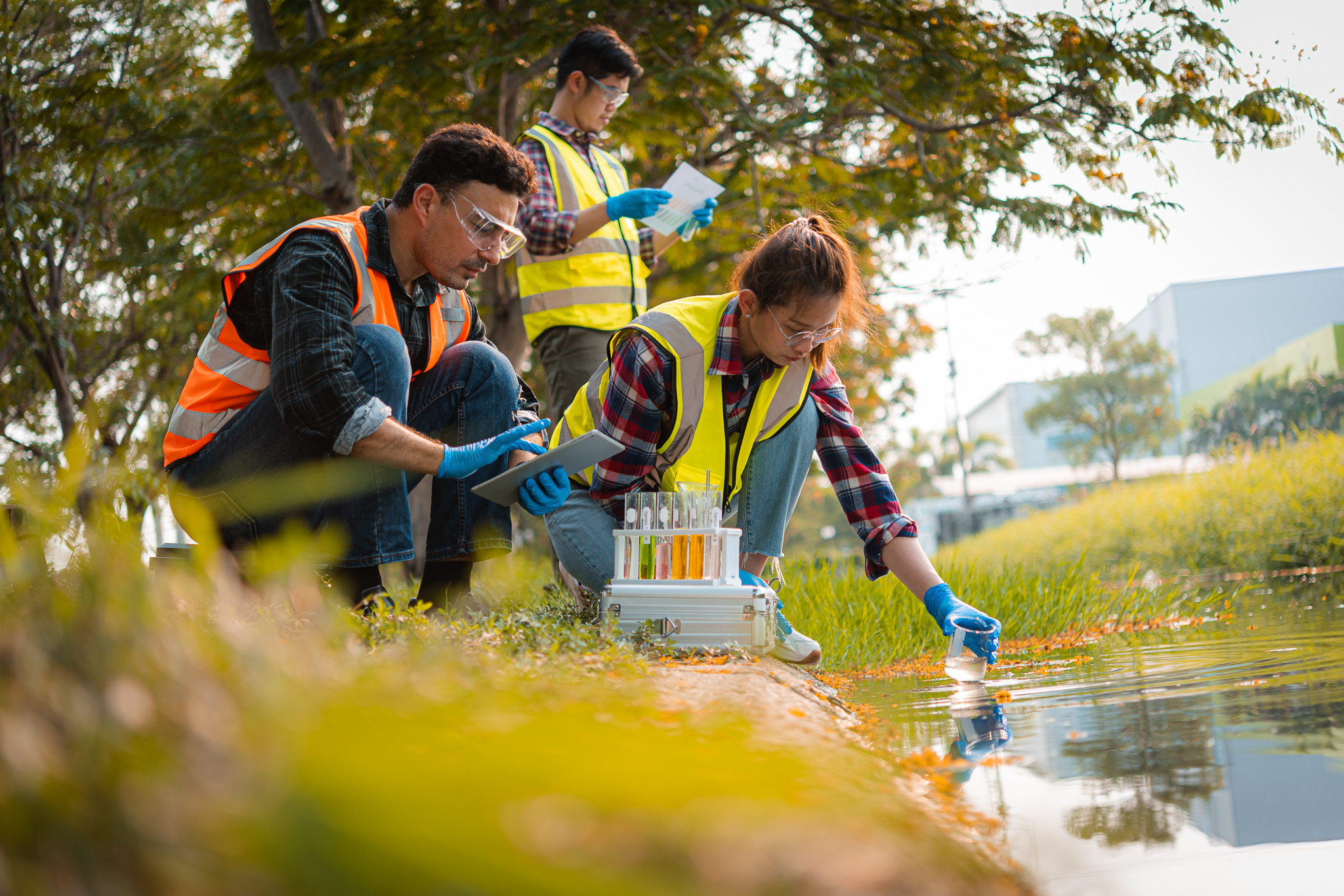 three people checking water safety
